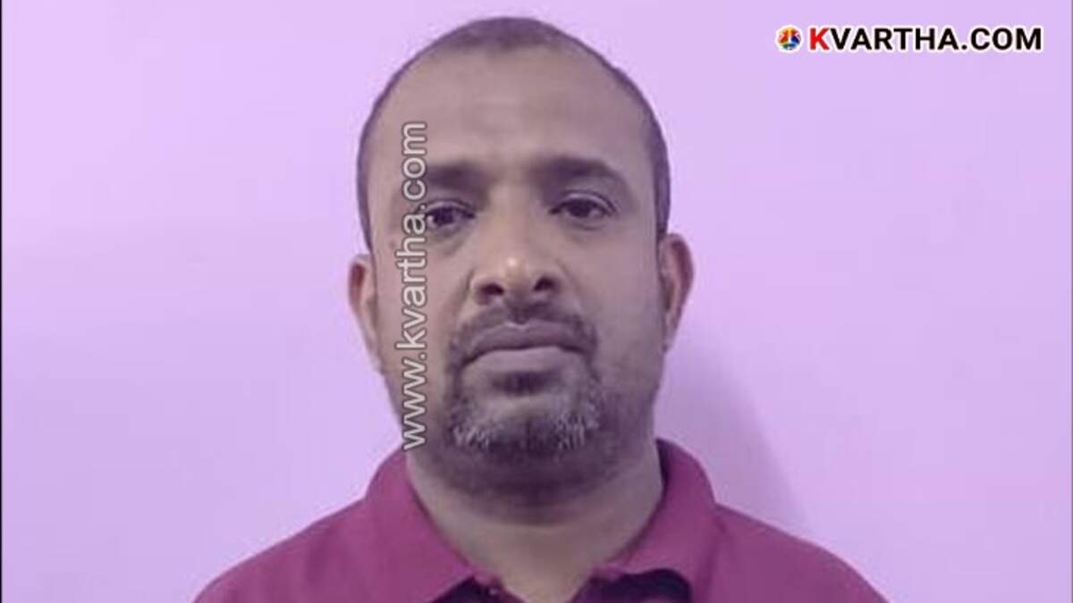 Kerala police arresting a suspect in an online trading scam.