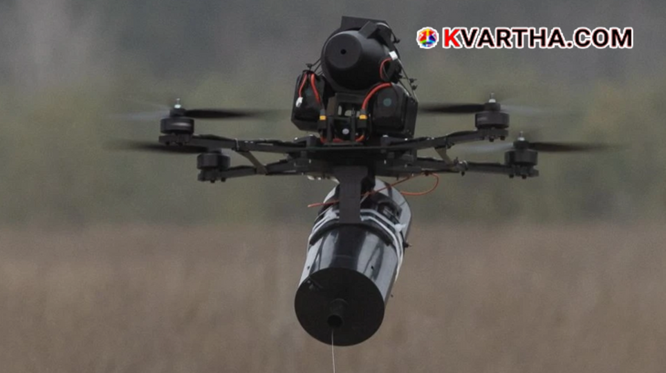 A close-up layout of a compact commercial FPV drone attached with a micro fiber-optic spool and components.
