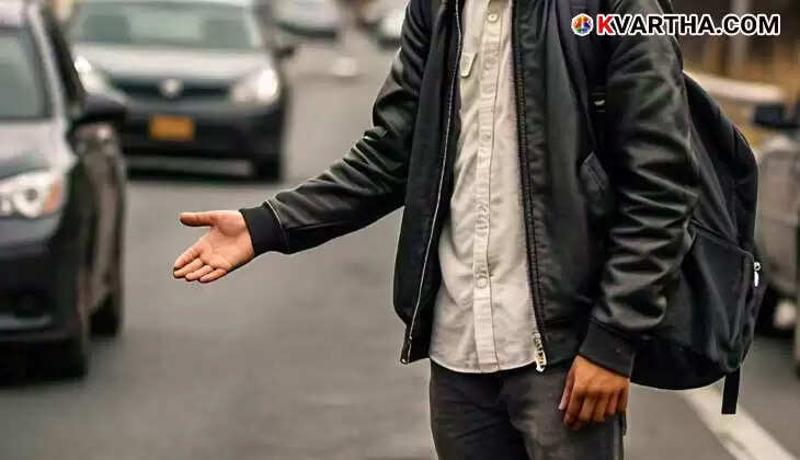 A student hitchhiking on a roadside