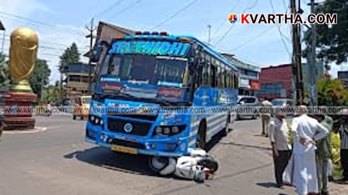 Scooter Rider Miraculously Escapes As Vehicle Gets Trapped Under Bus In Payyanur; Fire Force Rescues Bike