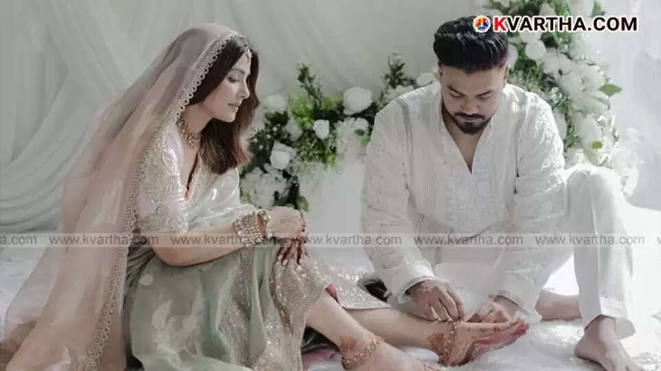 Hina Khan and Rocky Jaiswal on their wedding day, smiling.