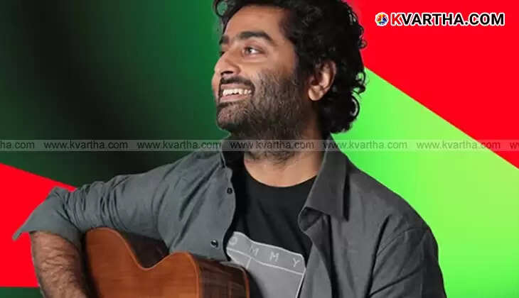 Arijit Singh performing on stage.