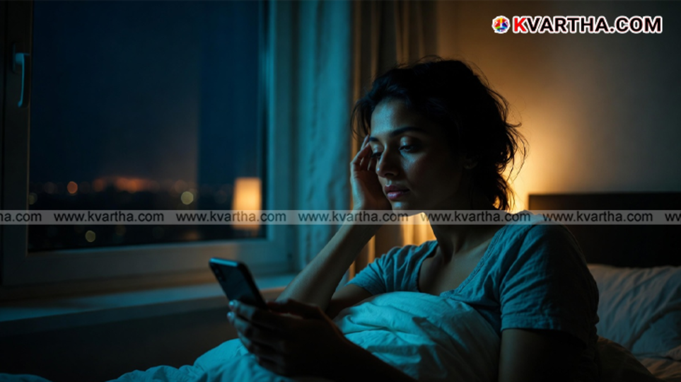 A person lying in bed looking at an alarm clock late at night.