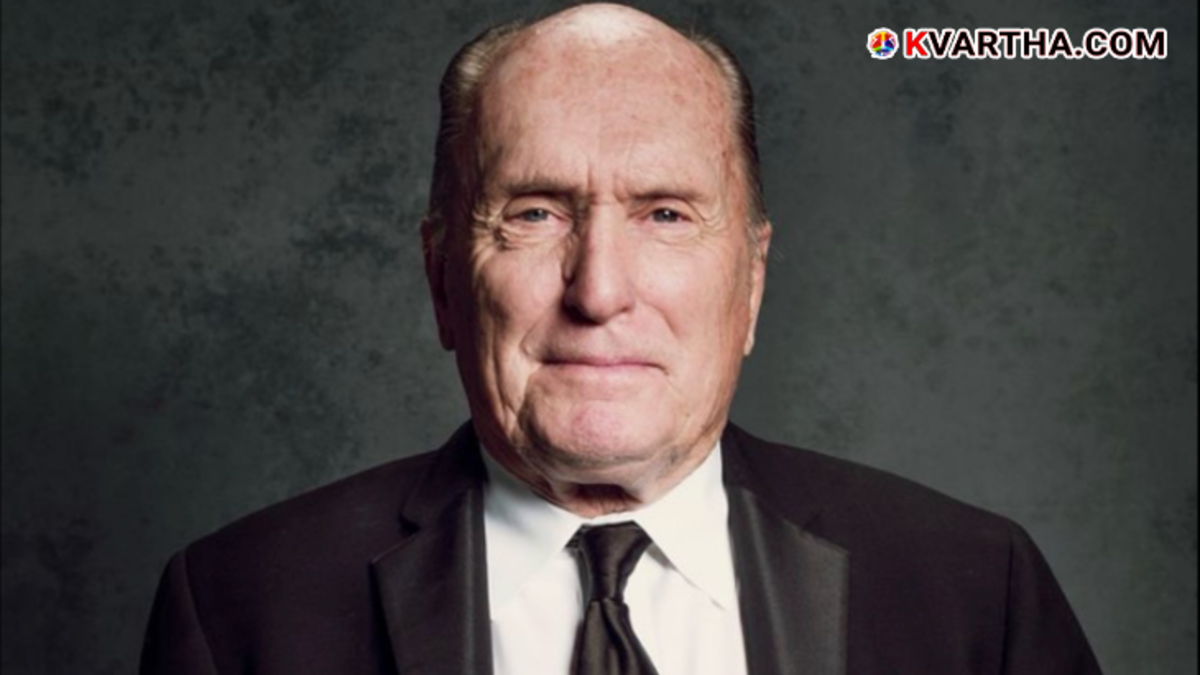 A tribute photo of actor Robert Duvall highlighting his Oscar win and famous roles.