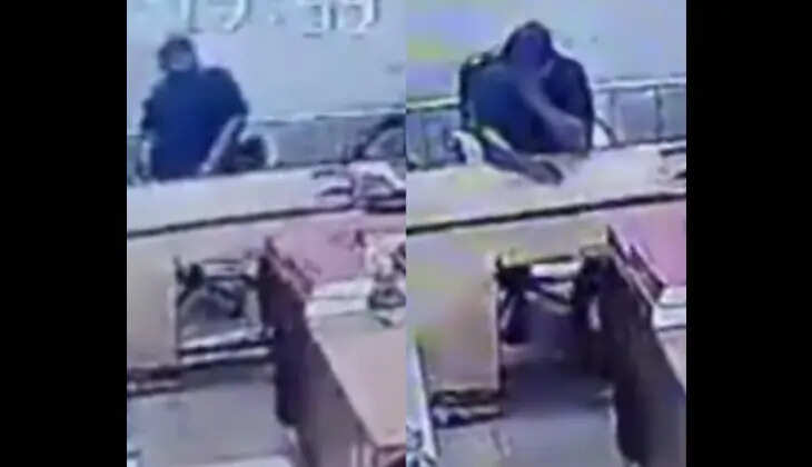 A man collapsing on the office floor.