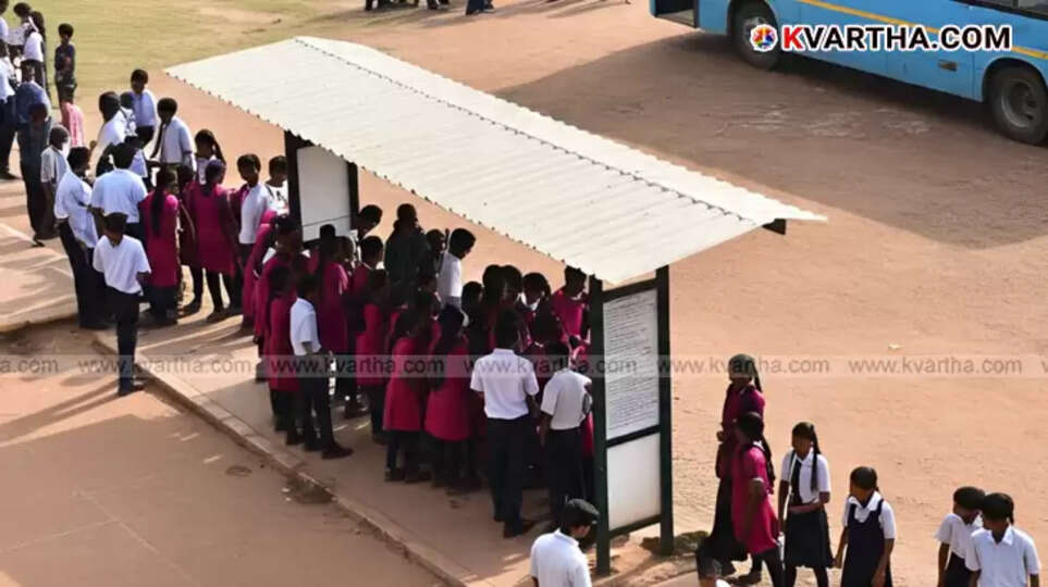 School students waiting for a bus at a bus stop in a hilly region of Kottayam, Kerala.
