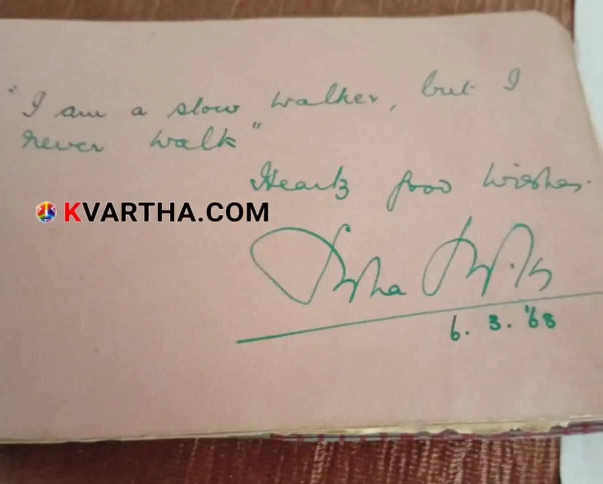 An old, hand-written autograph book with vintage pages.