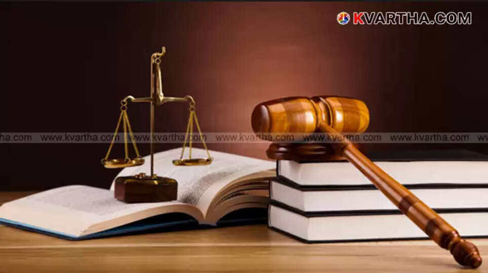 A low angle shot of lawyers in black coats walking inside a Kerala court.