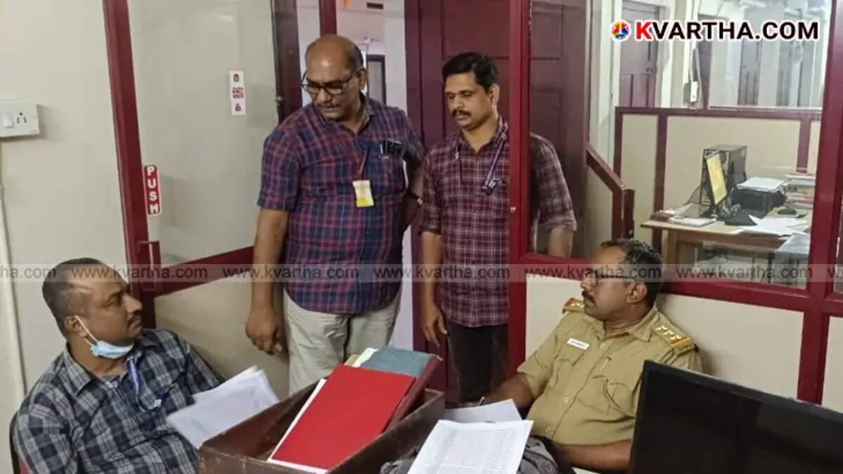 A photo representing a vigilance raid, in a government office.