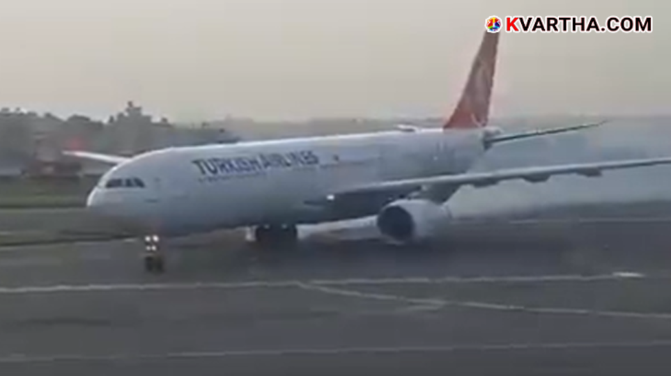 Smoke billowing from the tires of a Turkish Airlines flight at Kathmandu Airport.