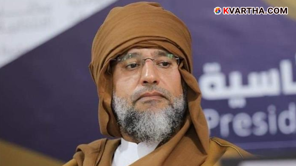 Saif al-Islam Gaddafi addressing a gathering in traditional Libyan attire