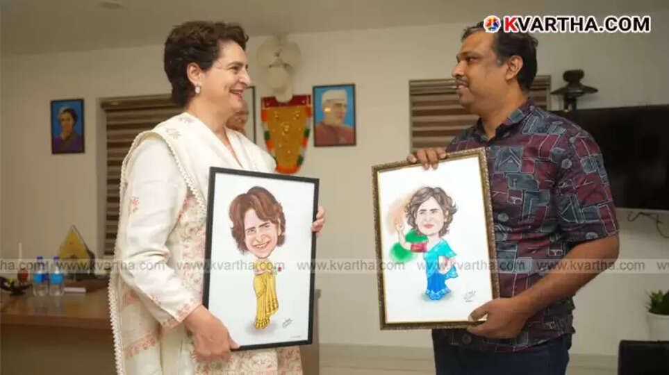 Cartoonist Basheer Kizhisery presents caricature to Priyanka Gandhi in Wayanad.