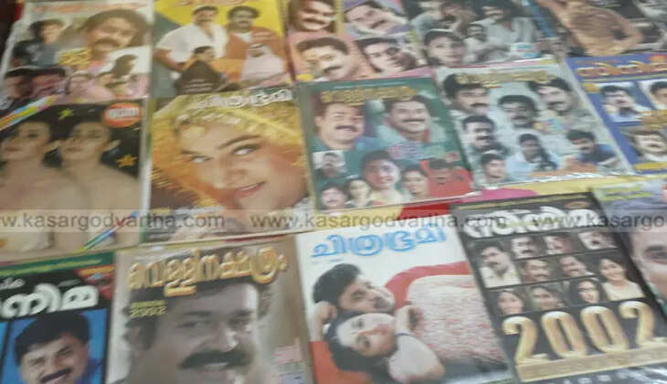 man with collection of rare cinema magazines and notices