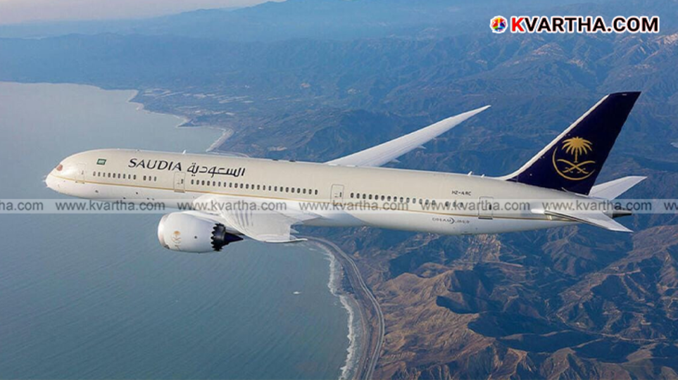  Saudi Airlines plane on tarmac with cloudy sky