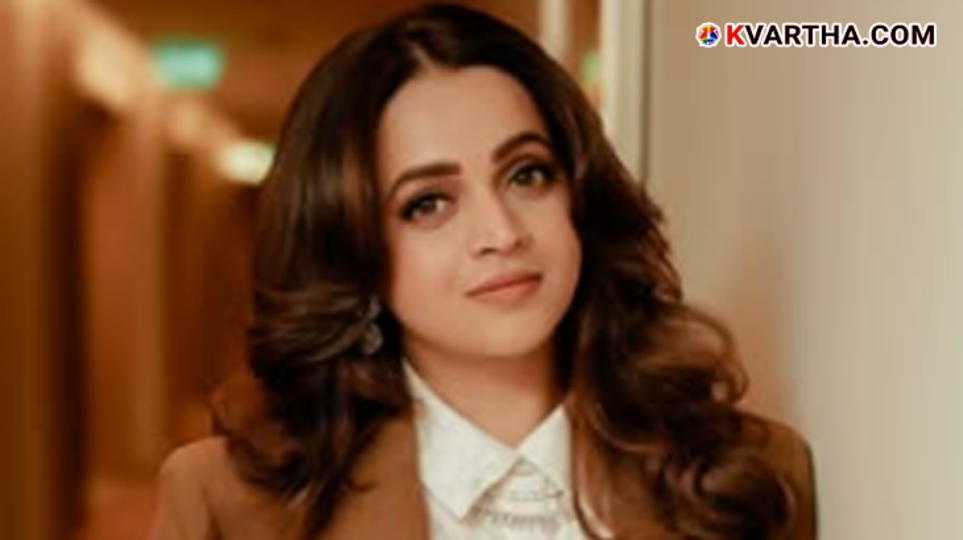 Actress Bhavana smiling during a promotional event for her movie Anomi