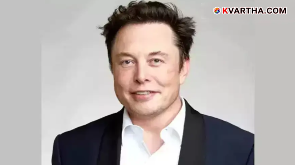 Elon Musk standing in front of a small prefabricated home.