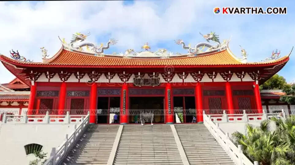 AI god Al-Masu appearing on a screen in a Malaysian temple.