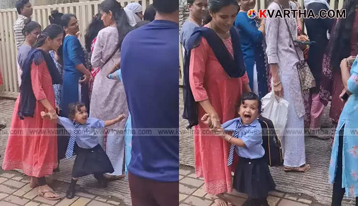 Little girl crying at school gate refusing to go home.