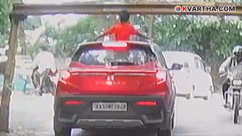 A child's head hitting the roof of a car through an open sunroof, a dangerous situation.