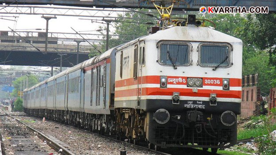 Security personnel checking a train coach with sniffer dogs.