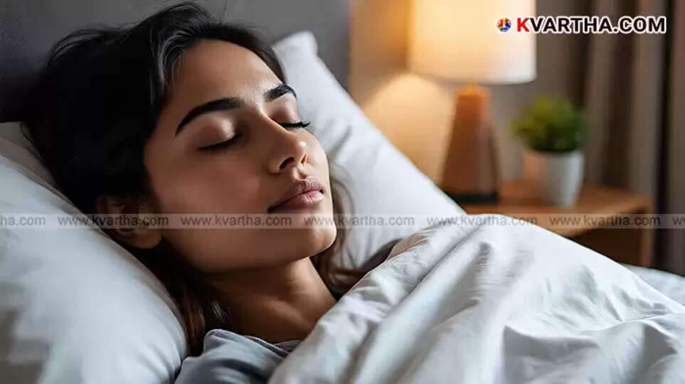 A person's foot peeking out from under a blanket, suggesting coolness for sleep.