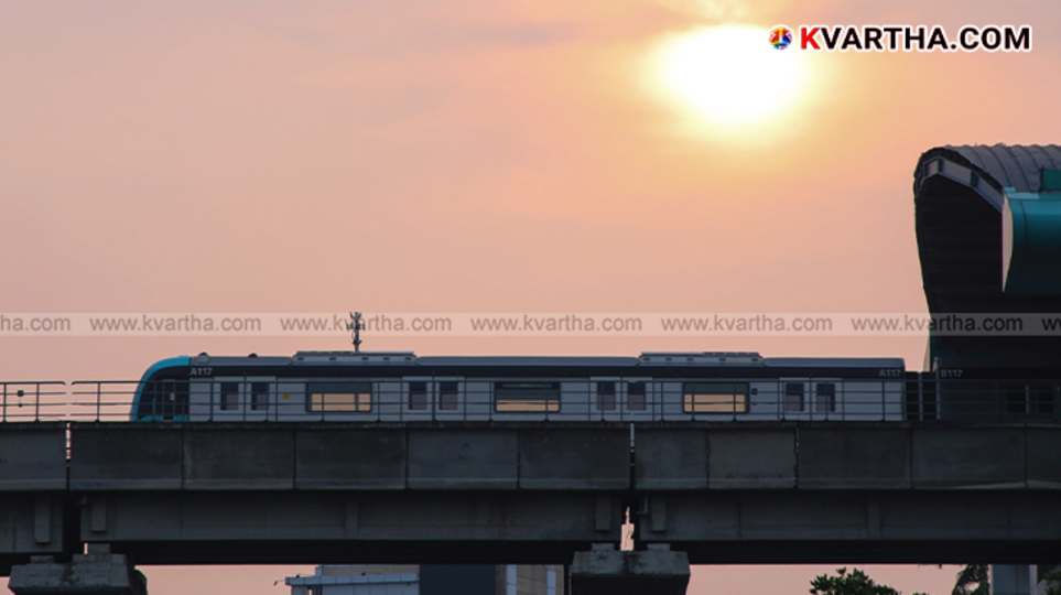 Empty metro train station at night with tracks.