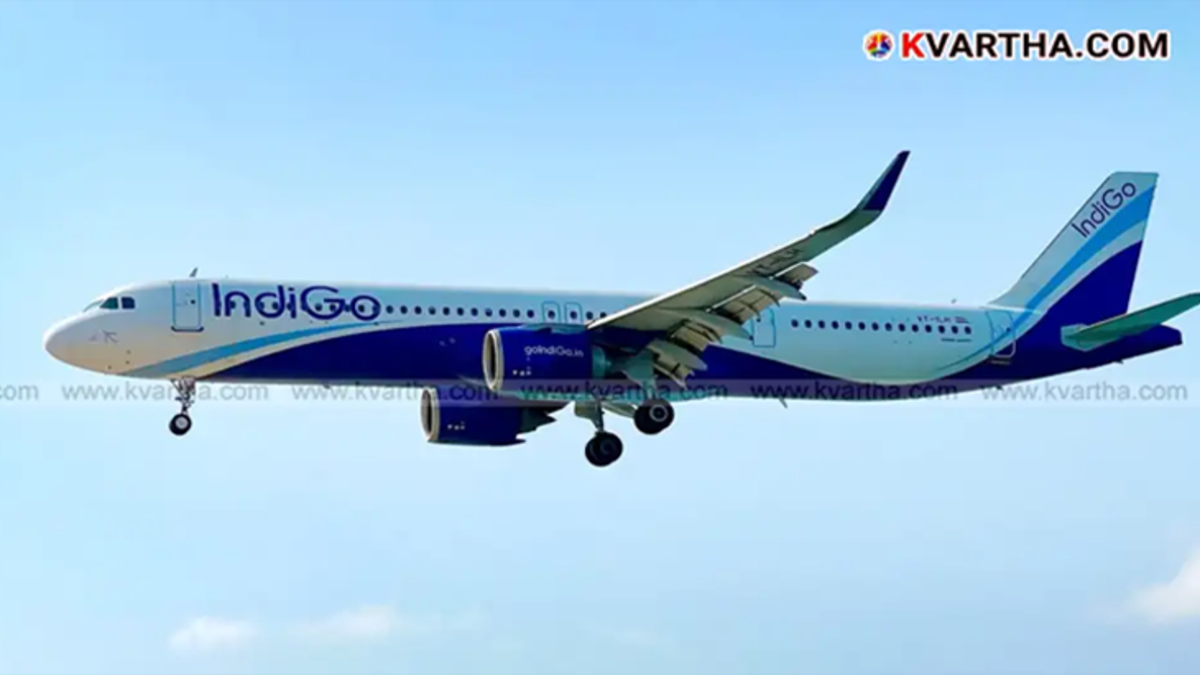 An IndiGo airlines plane on the runway.
