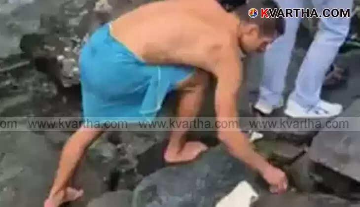 Tourist picks plastic waste