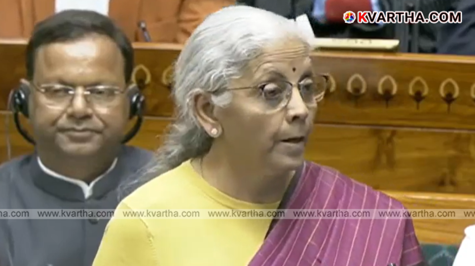 A group of female students walking in a university campus with books.