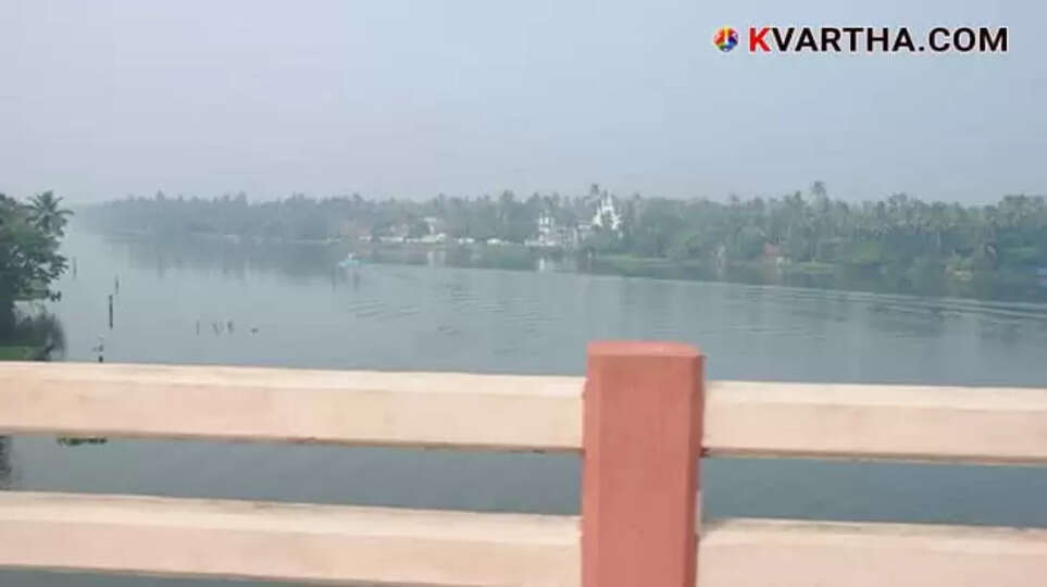 Photo Representing Police conducting evidence collection with the accused mother at Moolamkulam bridge.