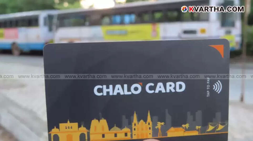 KSRTC bus conductor holding the new Chalo card ticket machine.