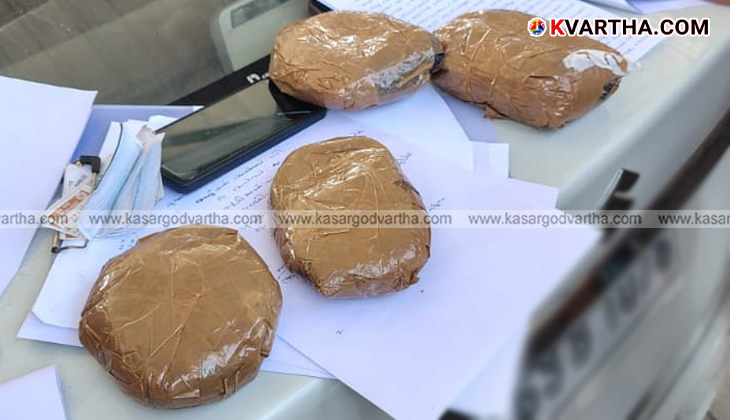 Police displaying seized Hashish oil in Payyanur after arresting two suspects.