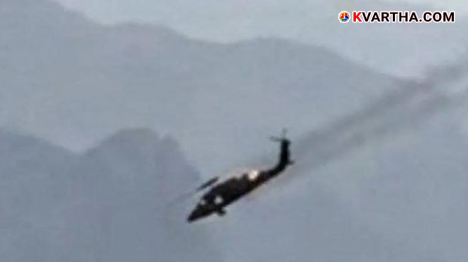 Representational image of a military helicopter crash and smoke rising from a mountainous region in Iran.