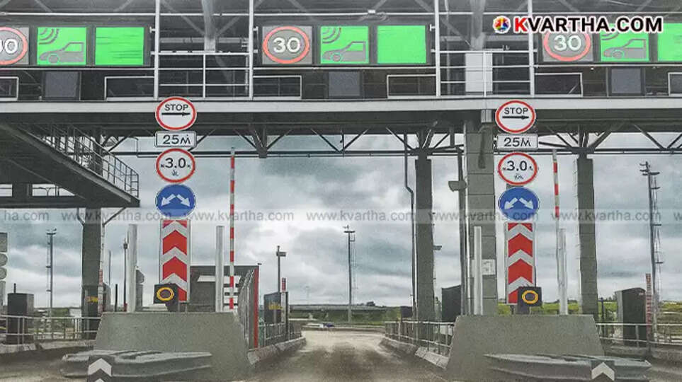 Close-up image of a Fastag sticker on a vehicle windshield.