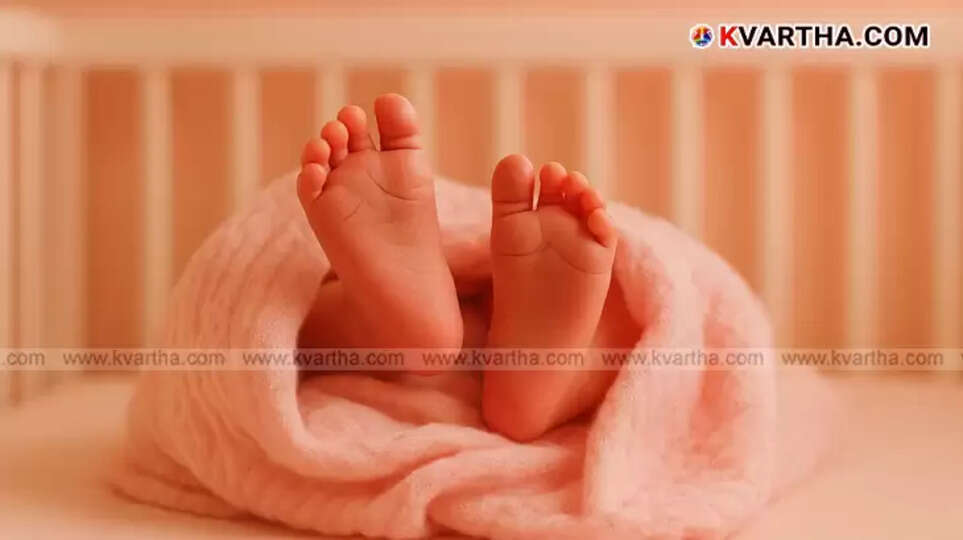  Woman being attended by medical staff and railway personnel on Aluva railway platform after giving birth.