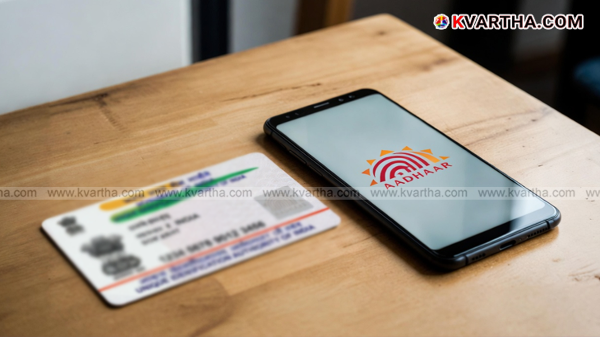 A smartphone displaying the new Aadhaar App interface with the 'Update Mobile Number' option.