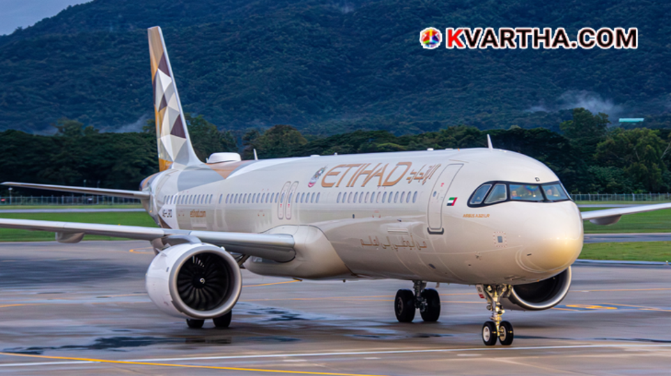 An Etihad Airways aircraft on the runway with emergency services nearby.