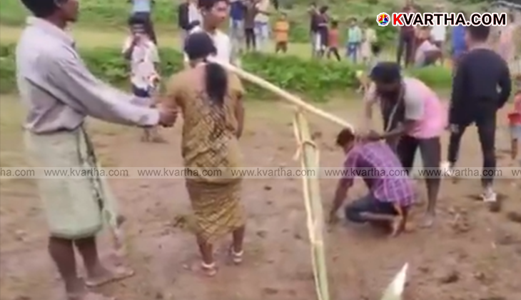 Image of a couple tied to a yoke in a field