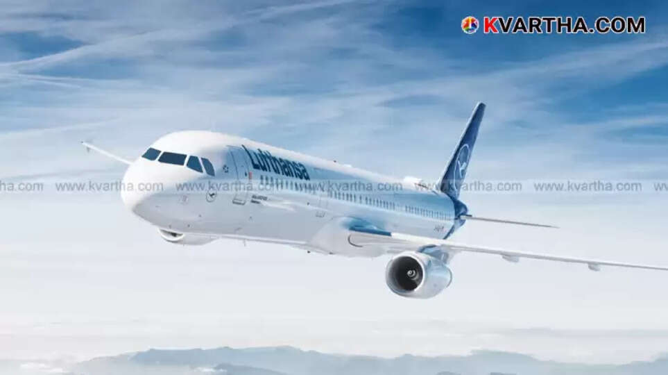 A Lufthansa airplane parked at an airport terminal.