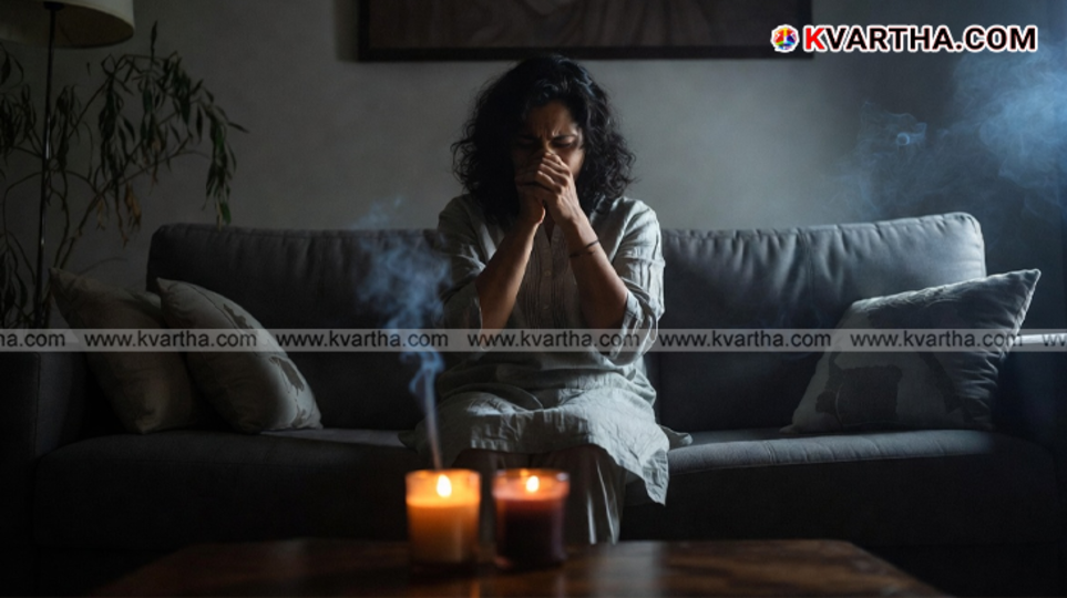 A burning scented candle releasing smoke in a home setting