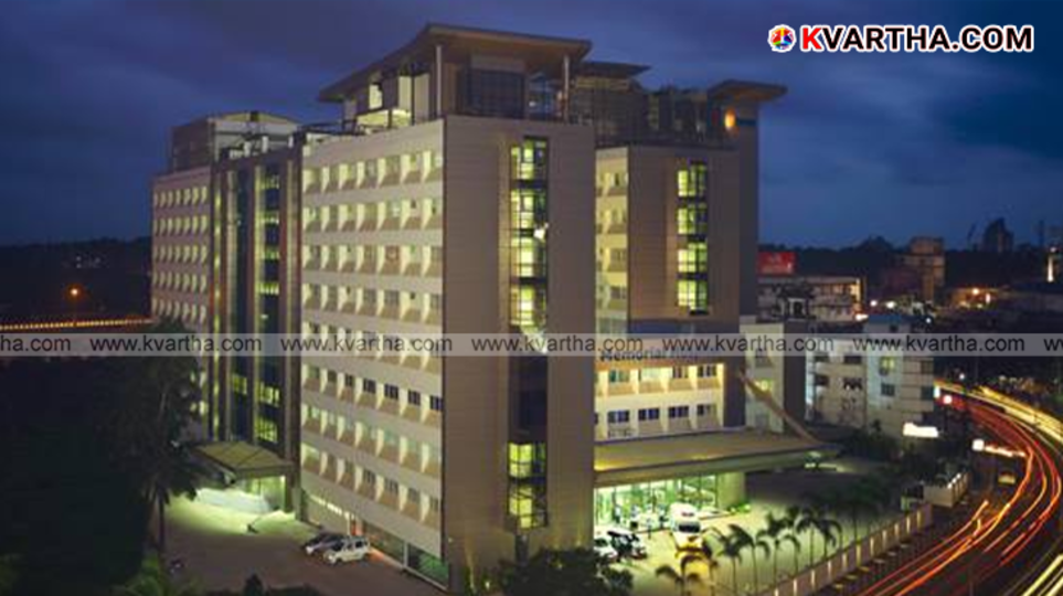  Smoke seen rising from the top of Baby Memorial Hospital building.