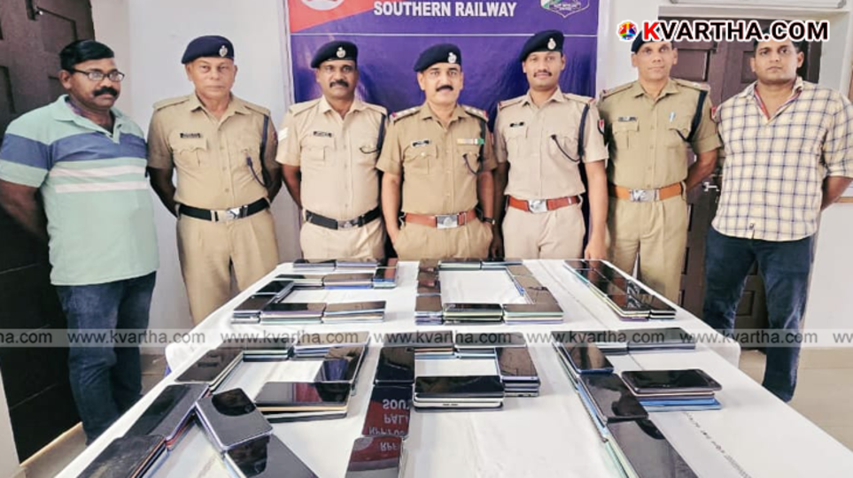  RPF officials displaying seized mobile phones at Mangaluru Junction station