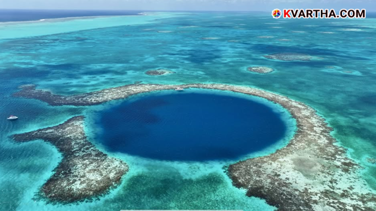 Aerial view of the Great Blue Hole in Belize surrounded by coral reefs