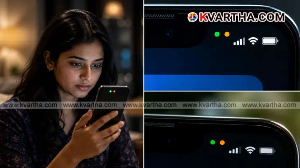 Close up of an iPhone status bar showing the green and orange privacy indicator dots