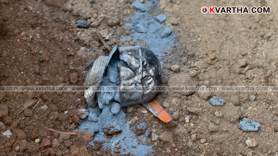Police officers inspecting the site of a bomb explosion in Poyiloor, Kannur.