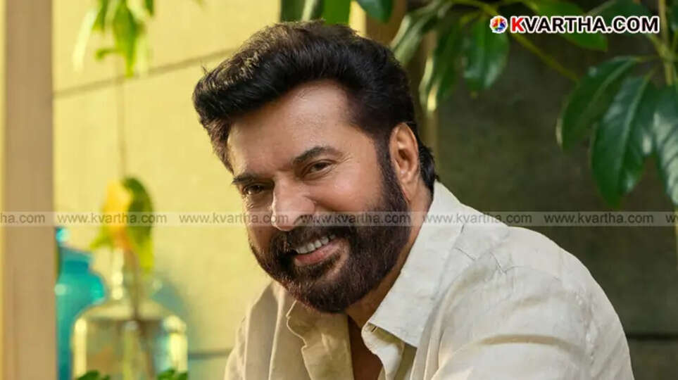 Megastar Mammootty smiling for a photo.