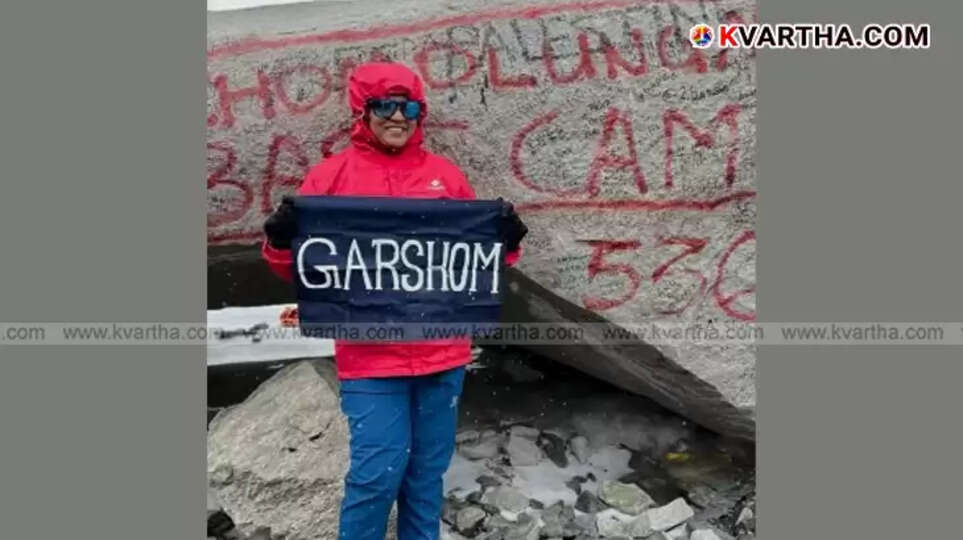 Snisha Rajesh holding Indian flag at Everest Base Camp