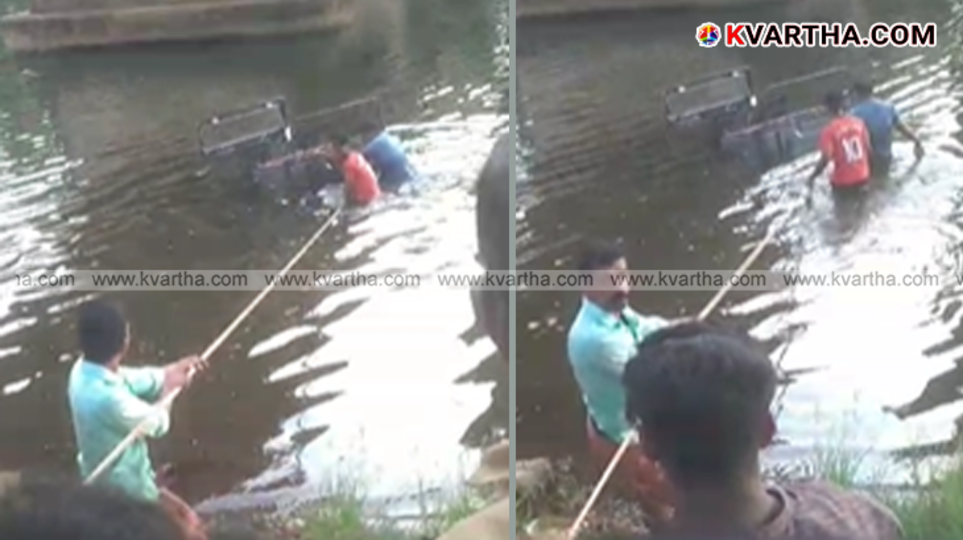 Locals and police are using ropes to pull an open jeep that fell into the river in Mambaram, Kannur.