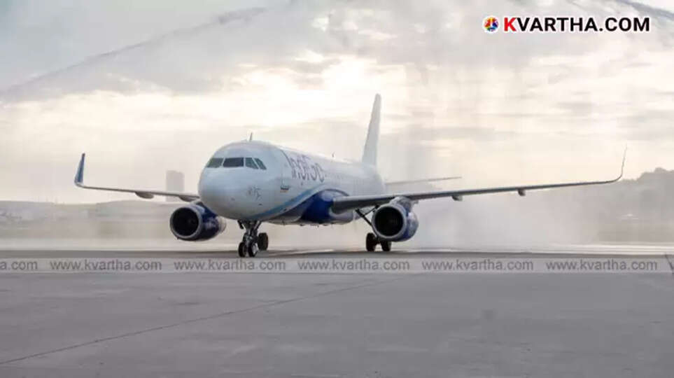 View of Indira Gandhi International Airport, Delhi, with flight information display boards.