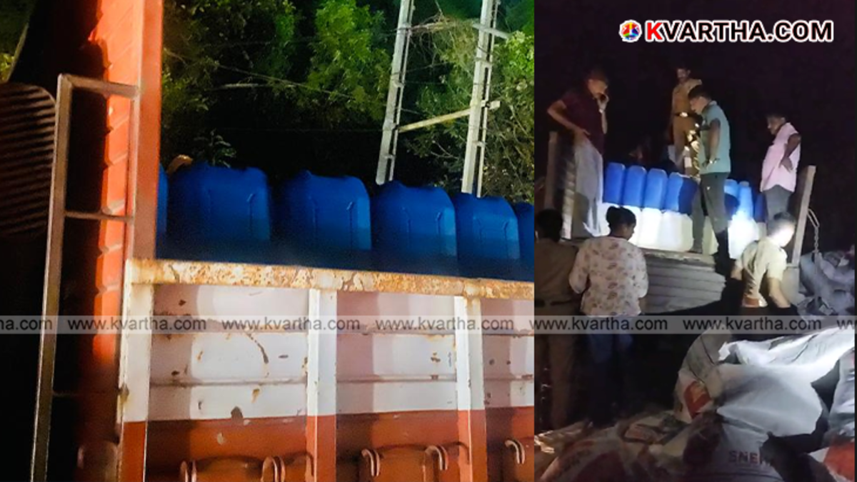 Excise officials inspecting seized spirit containers hidden in a lorry in Kannur.